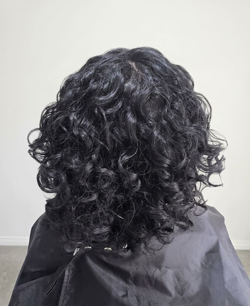Tight curls needing structure and moisture.