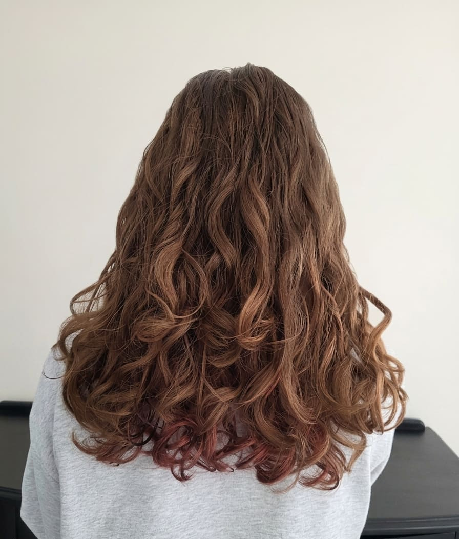 Rich, flowing curls with enhanced definition and movement.