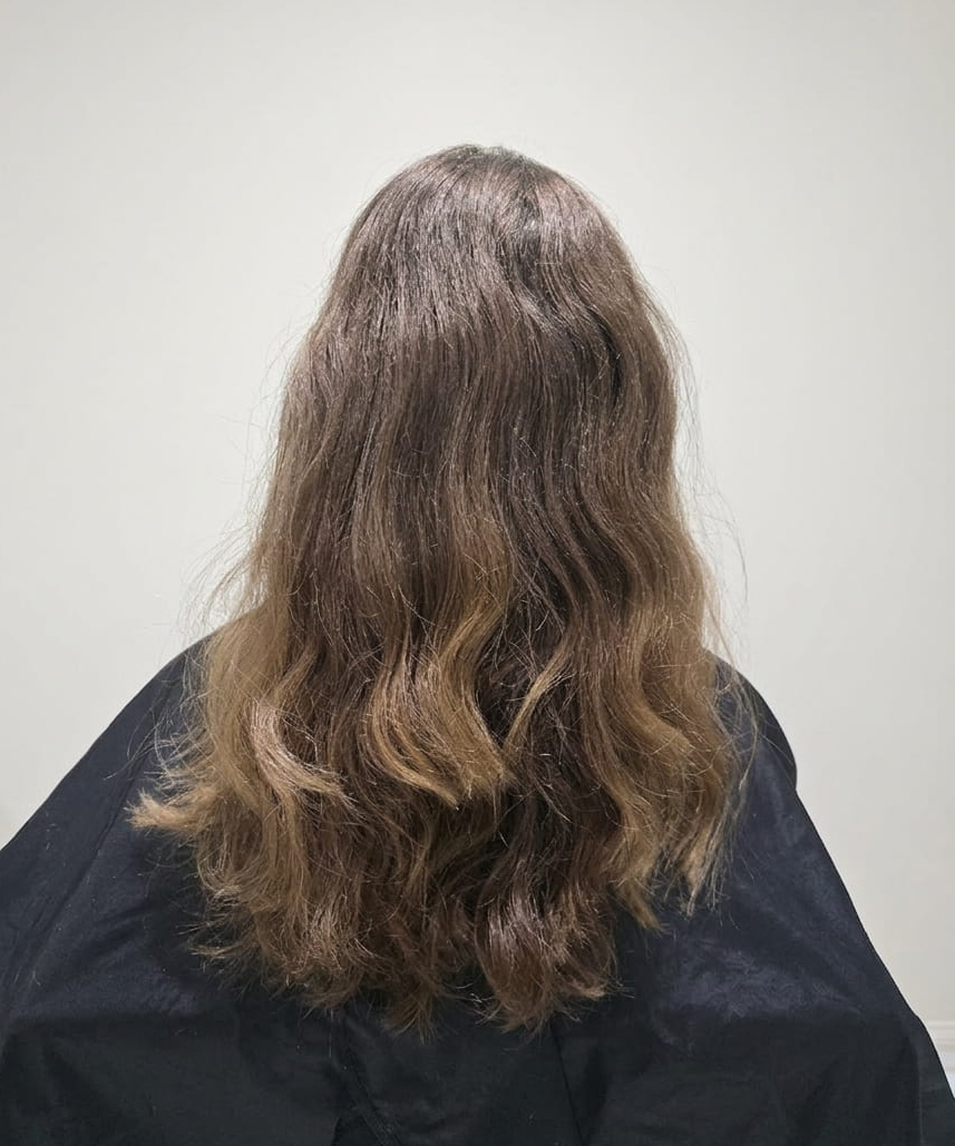 Stretched waves with an uneven curl pattern.