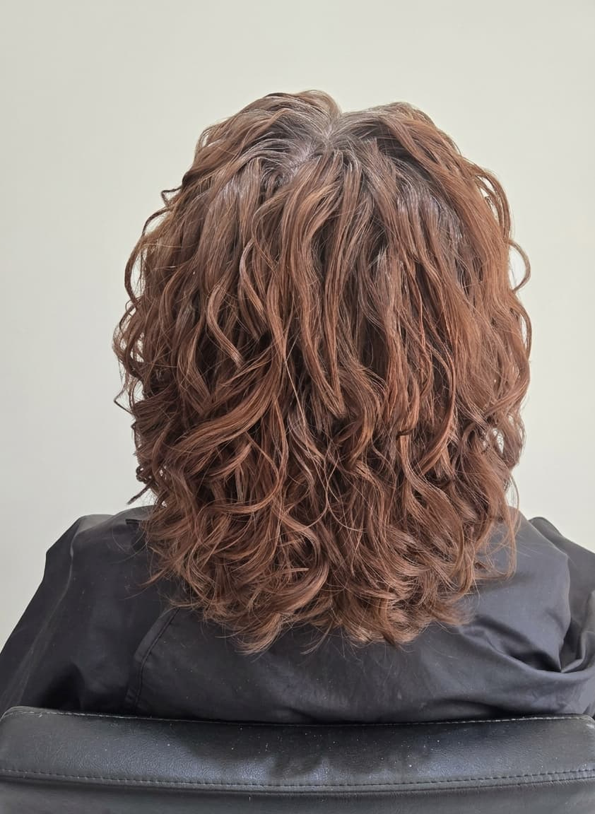 Sculpted copper curls with enhanced definition, body and movement.