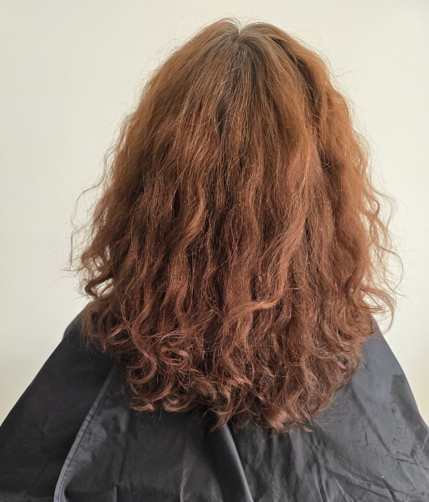 Loose copper waves with an undefined curl pattern.