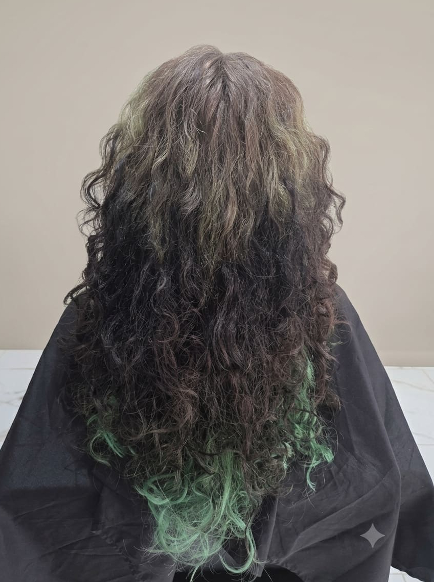 Heavy buildup masking natural curl pattern.