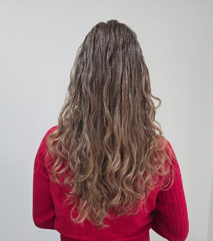 Glossy, sculpted curls radiating confidence and care.