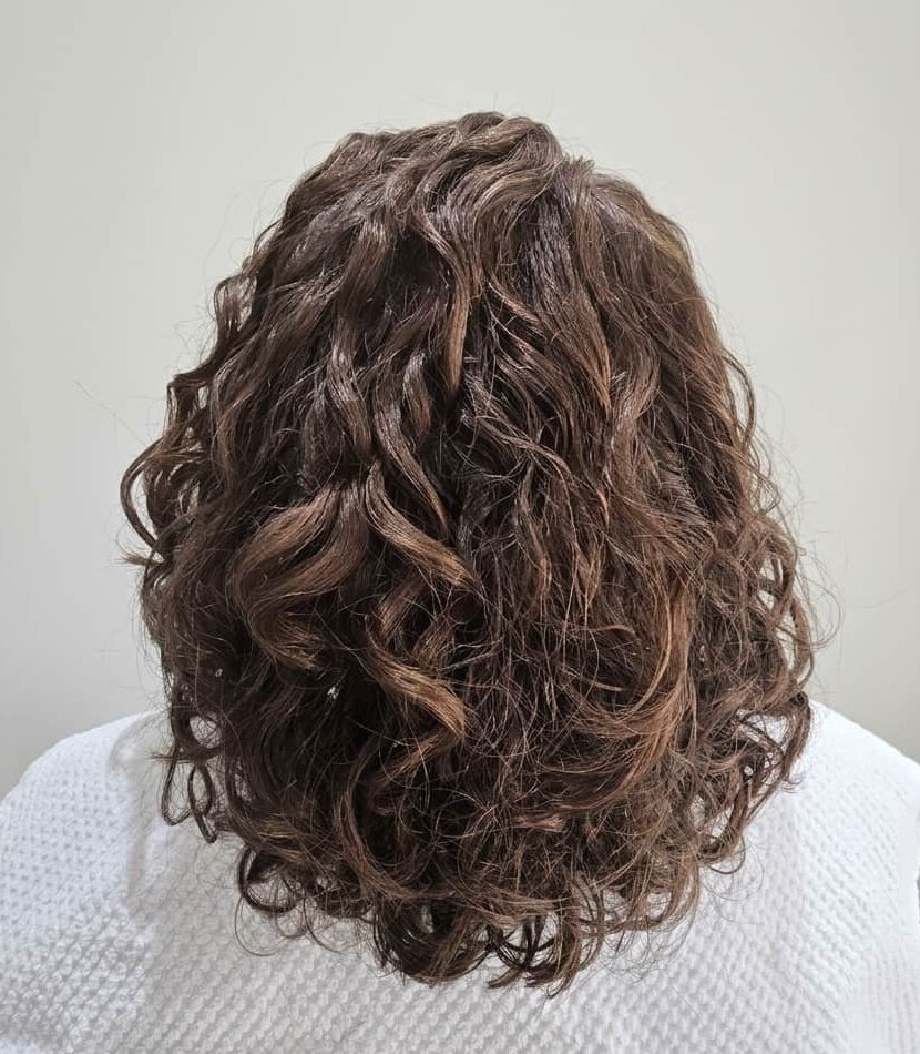 Hydrated curls restored with bounce and natural flow.