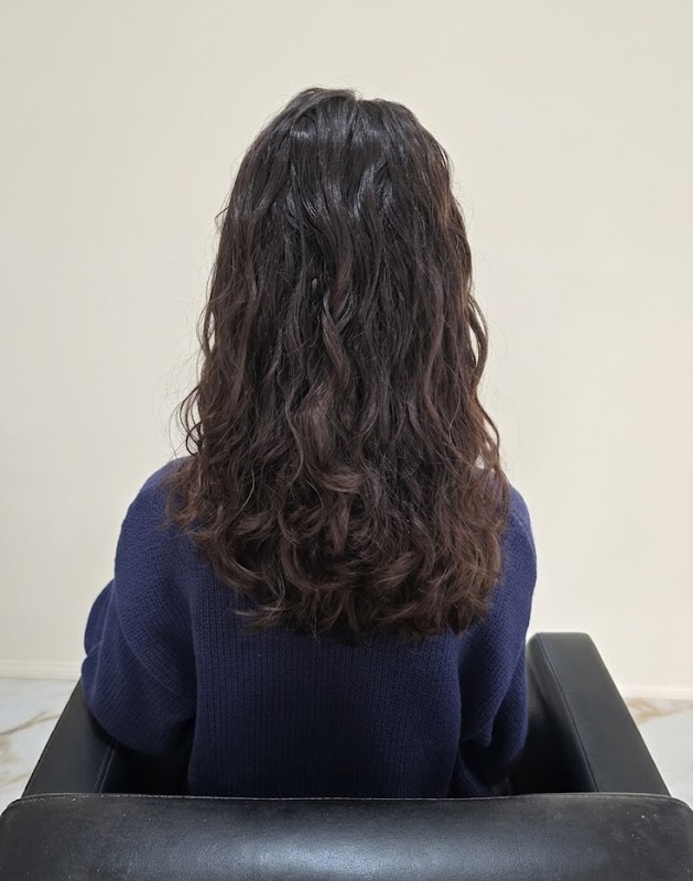 Moisture-infused curls embracing texture and radiance.