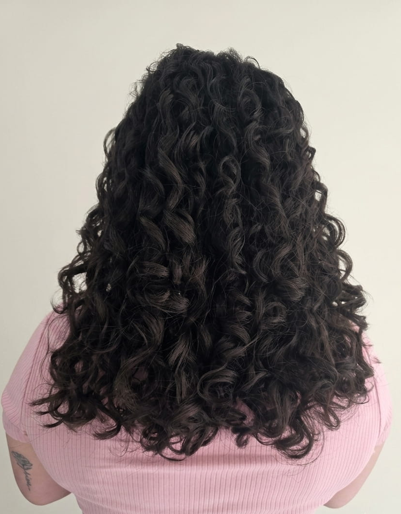Smooth, defined curls glowing with vitality and care.