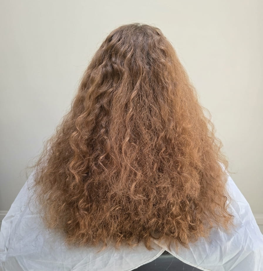 Frizz dominating the curl pattern.