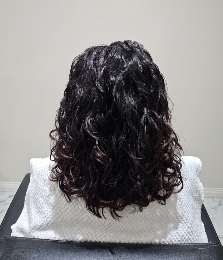 Hydrated curls restored with bounce and definition.