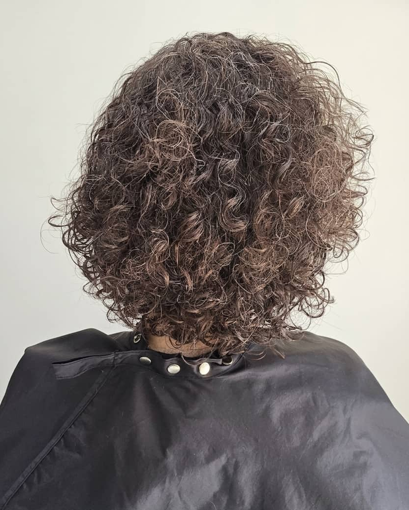 Tight curls needing structure and hydration.