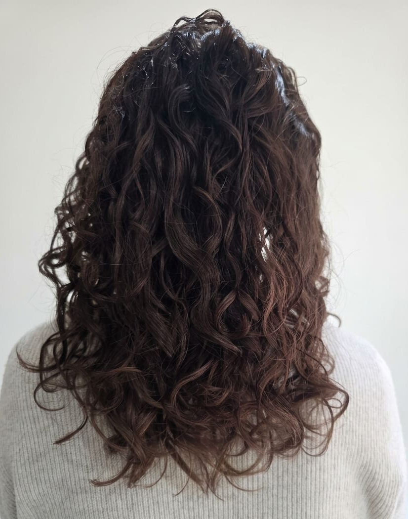 Clean, lightweight curls restored to their natural spring.