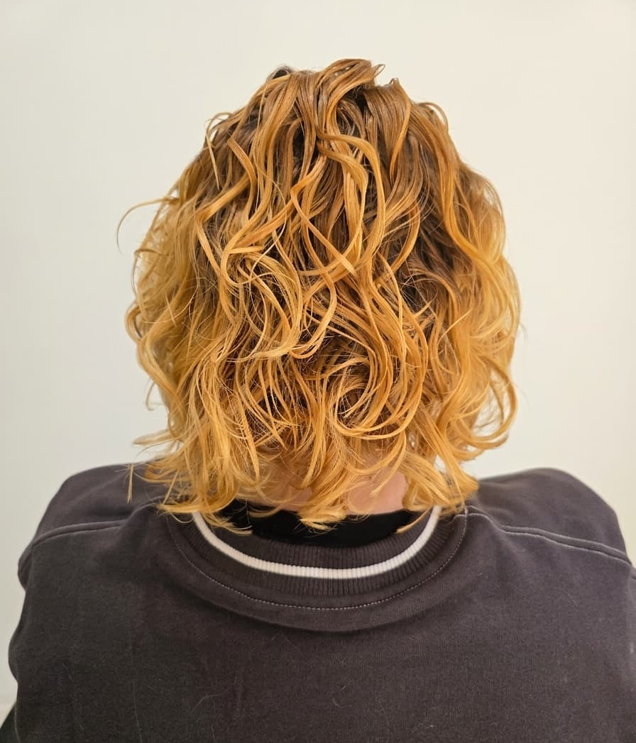 Soft, radiant curls embracing their natural pattern.