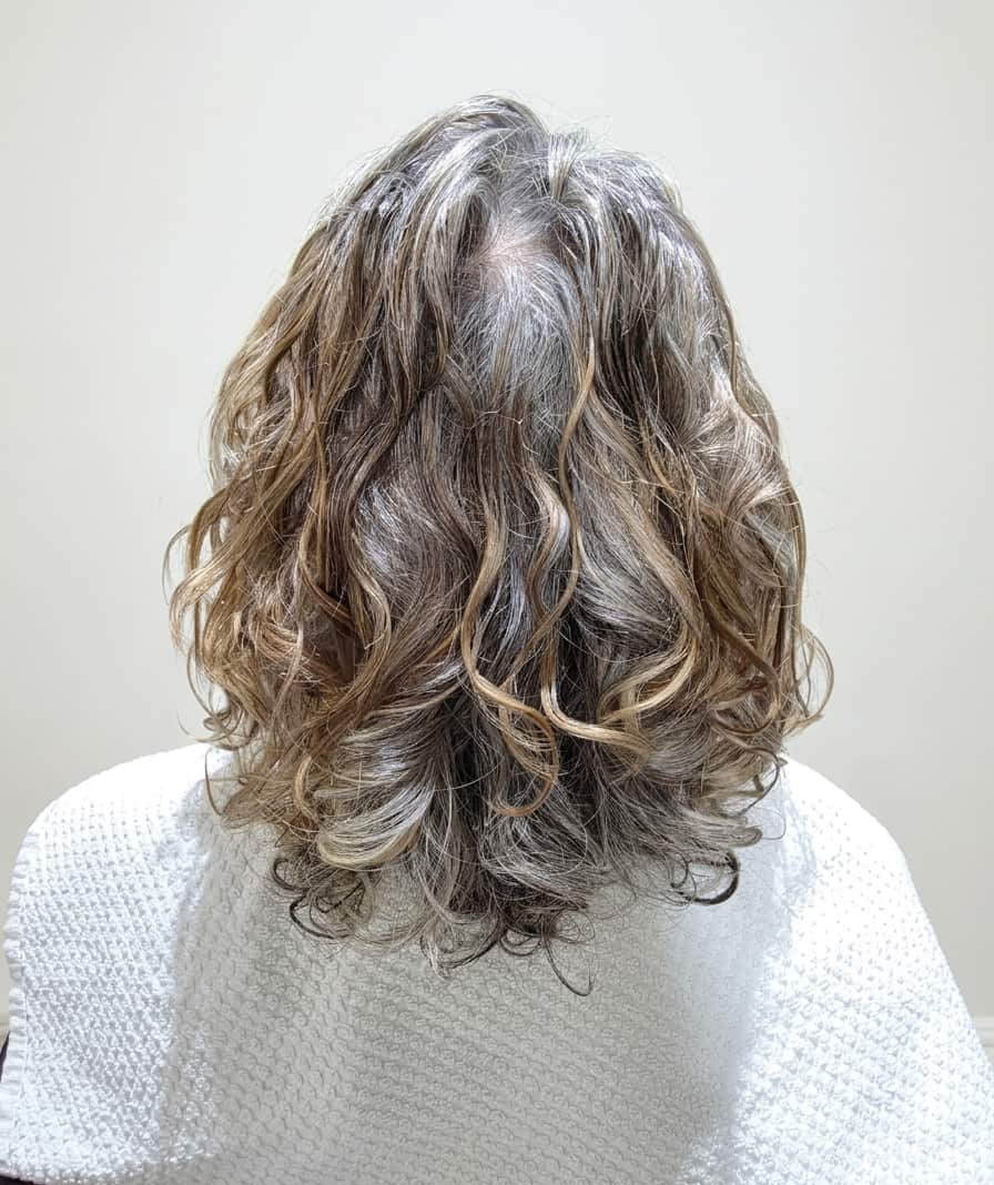 Clean, lightweight curls restored to their natural spring.