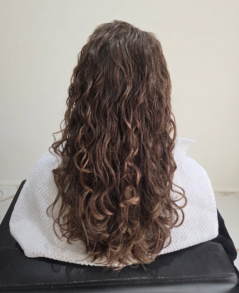 Glossy, sculpted curls radiating confidence and care.