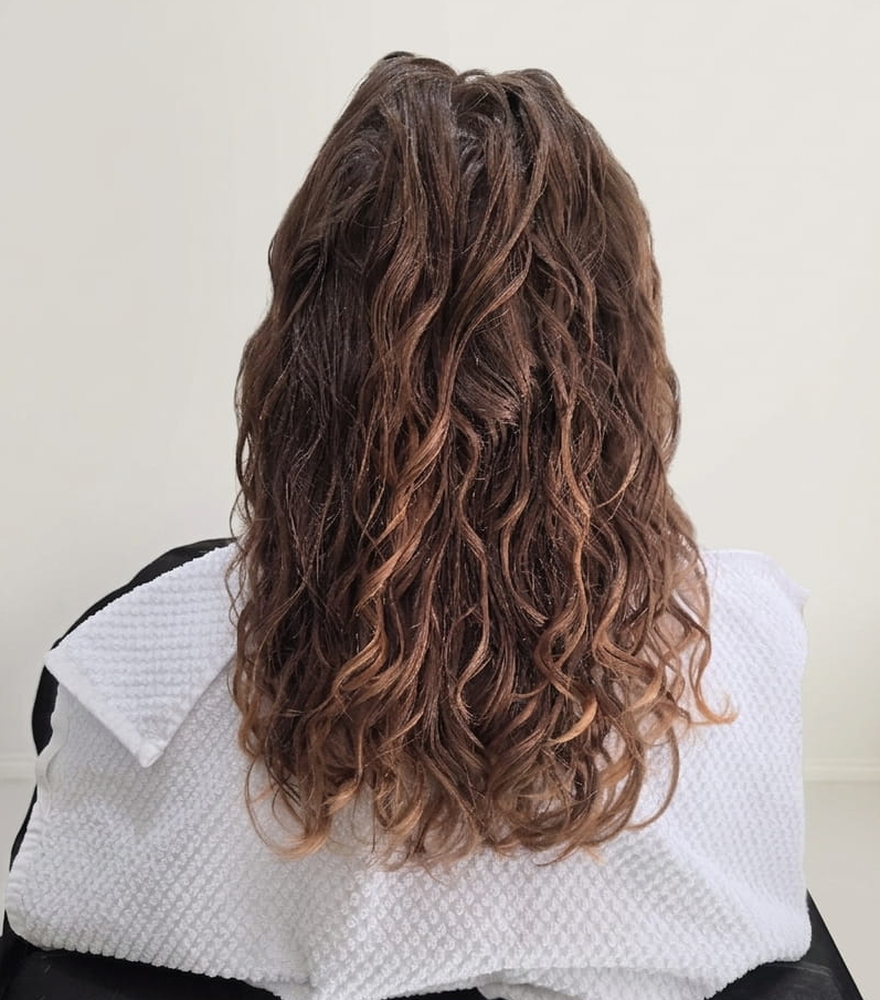 Clean, lightweight curls restored to their natural spring.
