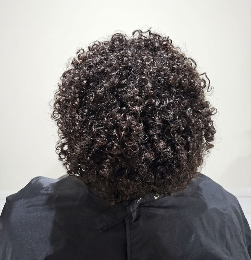 Glossy, sculpted curls radiating confidence and care.