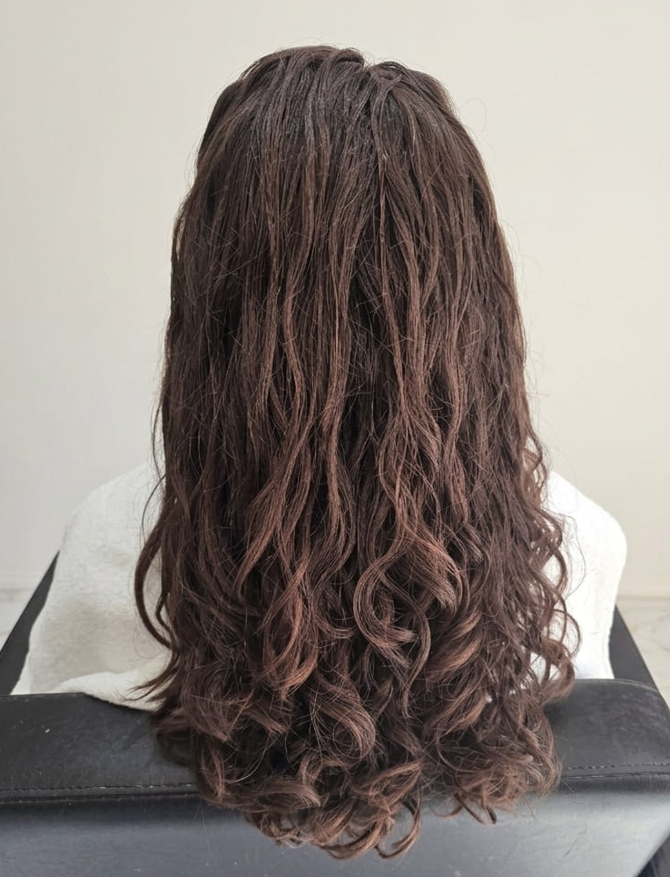 Clean, lightweight curls restored to their natural spring.