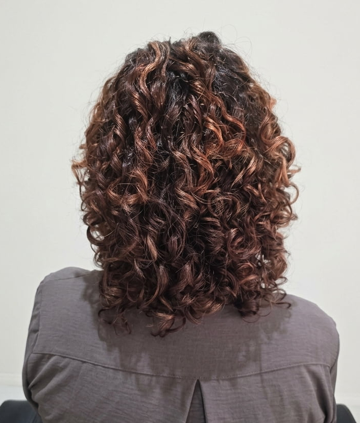 Refreshed ringlets with increased curl formation, lift, and texture.