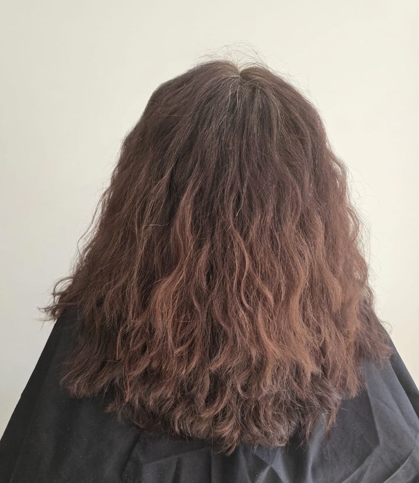 Dry ends and uneven curl formation.