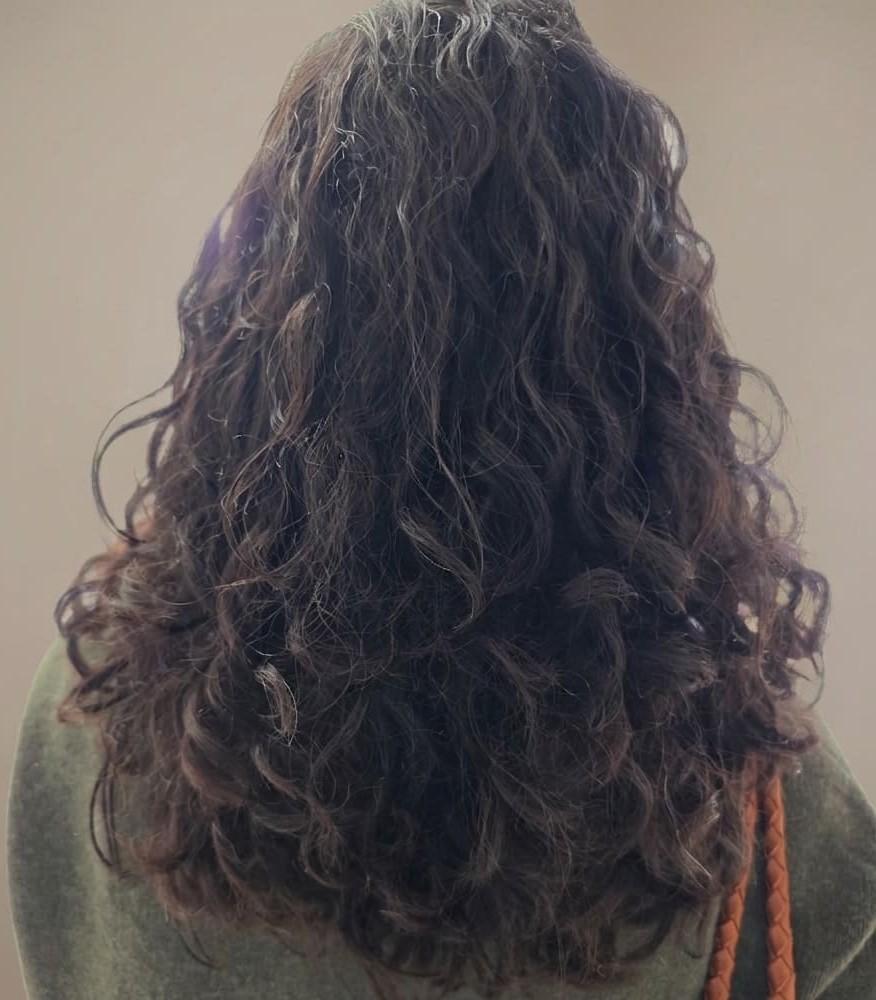 Vibrant, glossy curls radiating confidence and care.