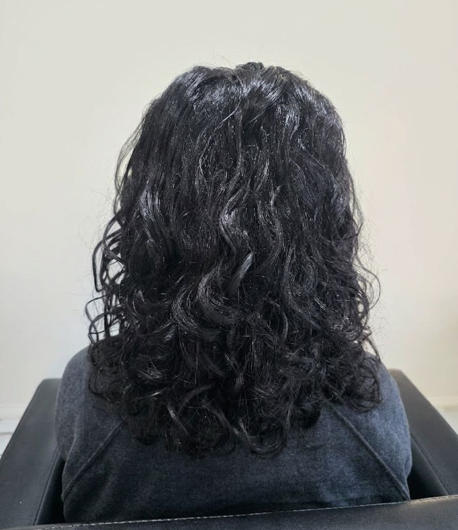 Defined layers and revived bounce — curls full of life again.
